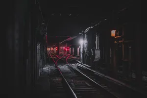 A Train Track In A Dark Tunnel Wallpaper