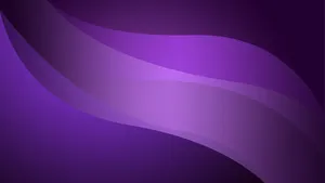 A Trendy Purple Laptop In Front Of Colorful Accessories Wallpaper