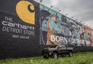 A Truck Parked In Front Of A Mural Wallpaper