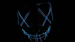 A Vibrant Blue Glow Illuminates The Night Sky Wallpaper