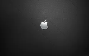 A View Of A Silver Apple Desktop Set Up With A Monitor And Keyboard Wallpaper