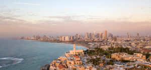 A View Of The City Of Tel Aviv And The Sea Wallpaper