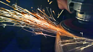 A Welder Employs Industrial Robots For Highly Accurate Cutting And Welding Wallpaper