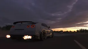 A White Car With Smoke Coming Out Of It Wallpaper