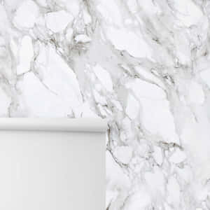 A White Marble Wall With A White Roll Of Paper Wallpaper