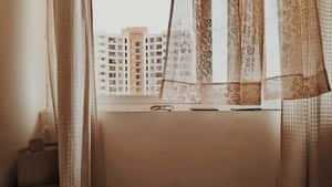 A Window With A Curtain Wallpaper