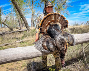 A Woman Holding A Turkey Wallpaper
