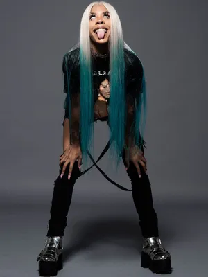 A Woman With Blue Hair Posing For A Photo Wallpaper