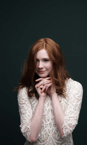 A Woman With Red Hair Posing For A Photo Wallpaper