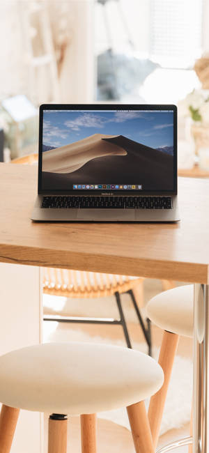 A Wooden Iphone Desk Setup Wallpaper