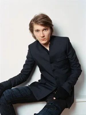 A Young Man In A Black Jacket And Jeans Wallpaper