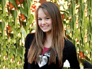 Actress Debby Ryan Strikes A Pose. Wallpaper