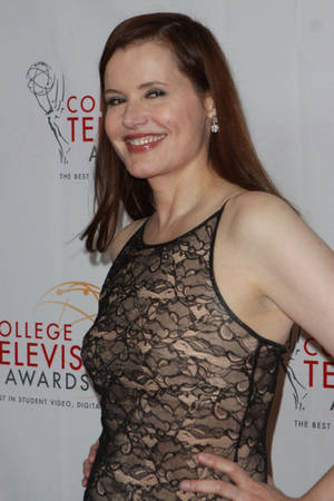 Actress Geena Davis In A Lace Design Dress Wallpaper