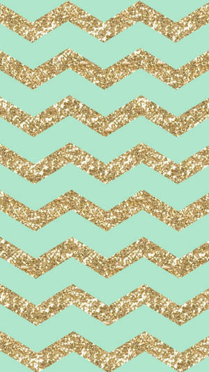 Add A Touch Of Elegance To Your Day With A Girly Gold And Blue Chevron Pattern Wallpaper