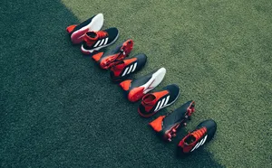 Adidas Shoes On Grass Wallpaper