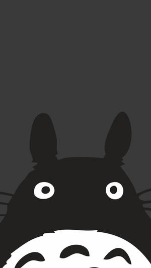 Adorable Black Kitten Looking Curiously At The Camera Wallpaper