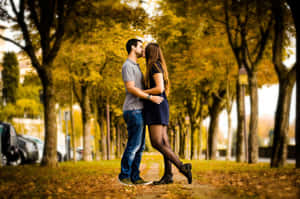 Adorable Couple Embracing Each Other Lovingly Wallpaper