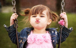 Adorable Pouting Baby Girl Wallpaper