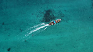 Aerial View Of Traditional Canoe In Papua New Guinea Wallpaper