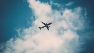 Aeroplane Dark Blue Cloudy Sky View Wallpaper