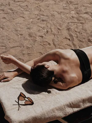 Aesthetic Beach Woman Tanning Wallpaper