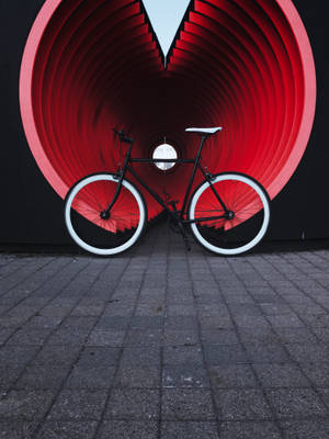 Aesthetic Bike And Red Tunnel Wallpaper