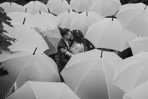Aesthetic Couple Surrounded With Umbrellas Wallpaper
