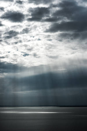 Aesthetic Sun Rays Gray Cloudy Sky Wallpaper