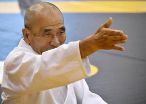 Aikido Sensei In Traditional Pose Wallpaper