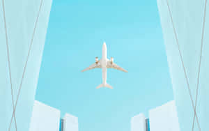 Airplane Framed By Buildings Sky View.jpg Wallpaper