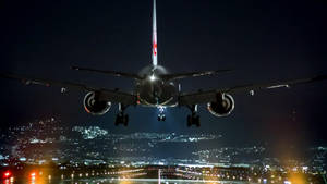 Airplane Landing At Night Wallpaper