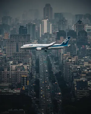 Airplane Over Taipei City Wallpaper