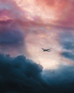 Airplane Pink And Blue Clouds Wallpaper