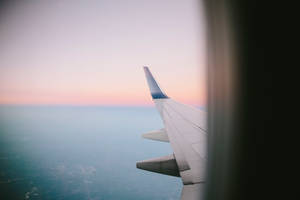 Airplane Window And Wing Shot Wallpaper