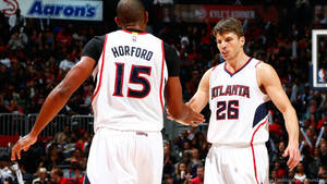 Al Horford Performing Pregame Handshake With Teammate Wallpaper