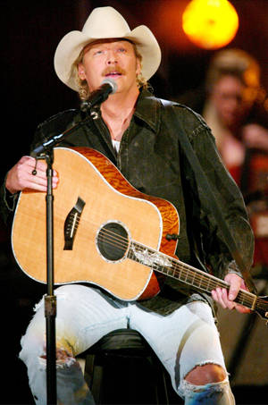 Alan Jackson Singing On Stage Wallpaper