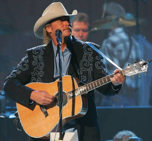 Alan Jackson With Guitar On Stage Wallpaper