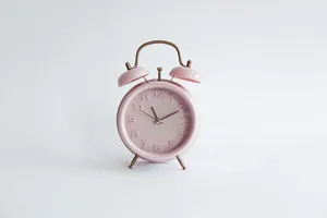 Alarm Clock In Pastel Pink Aesthetic Photo Wallpaper