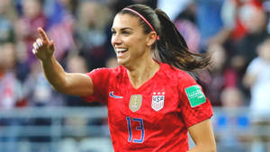 Alex Morgan In Red Nike Jersey Wallpaper