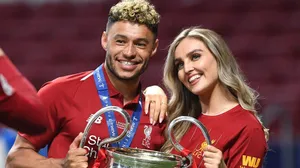 Alex Oxlade-chamberlain And Perrie Edwards Smiling Together Wallpaper