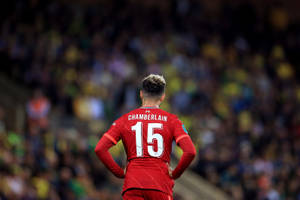 Alex Oxlade-chamberlain, Standing With Hands On Hips Like A True Maestro Of Football Wallpaper