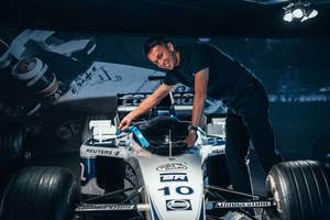 Alexander Albon Leaning Over Car Wallpaper