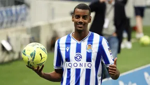 Alexander Isak Holding A Football Wallpaper