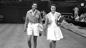 Althea Gibson And Angela Buxton Celebrating Tennis Victory Wallpaper