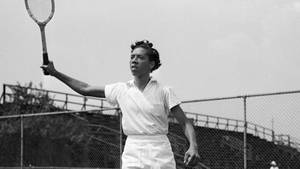 Althea Gibson Swinging In Major Tennis Championships Wallpaper