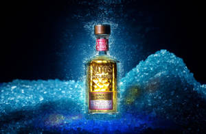 Altos Tequila Bottle On Blue Crystals Wallpaper