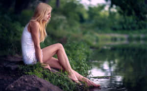 Amateur Model Sitting At River Wallpaper