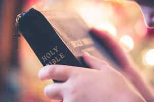 Amazing Hand With Holy Bible Wallpaper