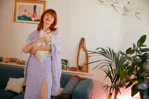 Amélie Pichard Holding Her Cat Wallpaper