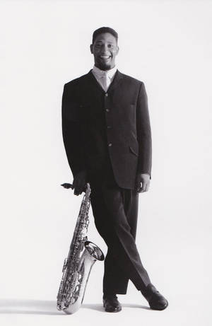 American Jazz Legend Sonny Rollins Playing Saxophone Wallpaper